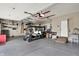 Well-organized garage with epoxy flooring, golf cart, and storage solutions at 4279 Redwood Ct, Zionsville, IN 46077