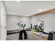Basement gym area with treadmill and rowing machine provides a convenient workout space at 4279 Redwood Ct, Zionsville, IN 46077
