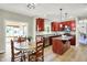 Bright kitchen featuring cherry cabinets, stainless appliances, and an adjacent breakfast nook at 4279 Redwood Ct, Zionsville, IN 46077