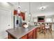 Spacious kitchen with an island, stainless steel refrigerator, and an open view to the living area at 4279 Redwood Ct, Zionsville, IN 46077