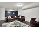 Spacious basement living room features a comfortable sectional, modern rug, and ample seating at 4279 Redwood Ct, Zionsville, IN 46077