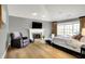 Spacious main bedroom with vaulted ceiling, fireplace, and natural light from large windows at 4279 Redwood Ct, Zionsville, IN 46077