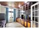 Office featuring custom built-in shelves, a unique ceiling, and natural light from a window at 4279 Redwood Ct, Zionsville, IN 46077