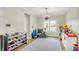 Play room featuring hardwood floors, neutral paint, crown moulding, and good natural light at 4279 Redwood Ct, Zionsville, IN 46077