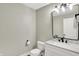 Stylish powder room with a modern vanity, elegant mirror, and neutral wall color at 4279 Redwood Ct, Zionsville, IN 46077