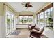 Bright sunroom with lots of windows that offers stunning views of the lake at 4279 Redwood Ct, Zionsville, IN 46077