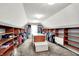 Spacious walk-in closet with custom shelving and center island storage at 4279 Redwood Ct, Zionsville, IN 46077