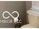 Bathroom with a white toilet, gray walls, and a chrome toilet paper holder at 459 Dekalb Dr, Westfield, IN 46074
