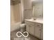 Clean bathroom with white fixtures including vanity, toilet, and tub/shower combination at 459 Dekalb Dr, Westfield, IN 46074