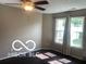 Bedroom with dark floors, light walls, and large windows with curtains at 459 Dekalb Dr, Westfield, IN 46074