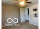 Bedroom with open doorway, installed TV mount, carpet, and overhead ceiling fan at 459 Dekalb Dr, Westfield, IN 46074