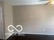 Empty bedroom featuring a ceiling fan, dark floors, and fresh neutral paint at 459 Dekalb Dr, Westfield, IN 46074