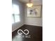 Charming dining area featuring dark hardwood floors, natural light, and elegant decor at 459 Dekalb Dr, Westfield, IN 46074