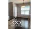Eat-in dining space with table, chandelier, and views of the backyard at 459 Dekalb Dr, Westfield, IN 46074