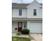 Charming townhome with a well-maintained lawn, an attached one car garage, and a red door at 459 Dekalb Dr, Westfield, IN 46074