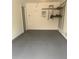 Epoxy floor in this garage with storage shelves and work area at 459 Dekalb Dr, Westfield, IN 46074