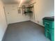 A residential garage features an epoxy floor and storage shelves to keep tools well organized at 459 Dekalb Dr, Westfield, IN 46074
