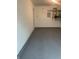 A garage features an epoxy floor for durability, and storage shelves for organization at 459 Dekalb Dr, Westfield, IN 46074