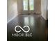 The living room has shiny wood floors and 2 bright windows at 459 Dekalb Dr, Westfield, IN 46074