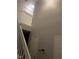A staircase and upper landing feature white trim and doors at 459 Dekalb Dr, Westfield, IN 46074