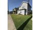 A charming home boasts a lush green lawn and inviting curb appeal at 46 S Warman S Ave, Indianapolis, IN 46222