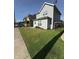 A charming home boasts a lush green lawn and inviting curb appeal at 46 S Warman S Ave, Indianapolis, IN 46222