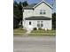 Charming two-story home featuring a well-maintained front yard with flower beds at 46 S Warman S Ave, Indianapolis, IN 46222