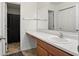 Clean bathroom with ample counter space, a large mirror, and a walk-in closet at 4643 Darla Ct, Indianapolis, IN 46239