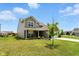 Charming two-story home with a covered porch, brick and vinyl exterior, well-manicured lawn, and an attached two-car garage at 4643 Darla Ct, Indianapolis, IN 46239