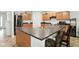 Bright kitchen features stainless steel appliances, plenty of cabinet space and a large island at 4643 Darla Ct, Indianapolis, IN 46239