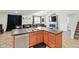 Kitchen view showcases a large island with a double sink, cabinetry, and an open floor plan at 4643 Darla Ct, Indianapolis, IN 46239