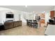 Open concept living room featuring a fireplace, TV, breakfast bar, and kitchen at 4643 Darla Ct, Indianapolis, IN 46239