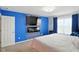 Bright bedroom features modern colors, a fireplace, and a tv at 4643 Darla Ct, Indianapolis, IN 46239