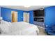 Modern bedroom with stylish decor features a fireplace, tv, and a seating area at 4643 Darla Ct, Indianapolis, IN 46239