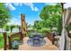 Outdoor back deck featuring stylish patio furniture with picturesque lake views and lush landscaping at 564 Gainesway N Dr, Greenwood, IN 46142