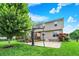 Large backyard featuring a basketball court, lush green lawn, and a patio area for outdoor activities and entertaining at 564 Gainesway N Dr, Greenwood, IN 46142