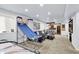 Finished basement showcasing a living area, bar, and basketball game for entertainment at 564 Gainesway N Dr, Greenwood, IN 46142
