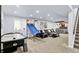 Entertaining basement featuring a living area, wet bar, and games perfect for Gathering fun at 564 Gainesway N Dr, Greenwood, IN 46142