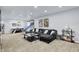 Open basement with games and living area is perfect for entertaining or relaxing at 564 Gainesway N Dr, Greenwood, IN 46142