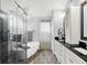 Luxurious bathroom featuring a soaking tub, a glass enclosed shower, and dual sinks at 564 Gainesway N Dr, Greenwood, IN 46142