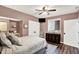 Bedroom features ceiling fan, natural light, closet and hardwood floors at 564 Gainesway N Dr, Greenwood, IN 46142