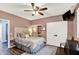 Cozy bedroom with ceiling fan, closet, and ensuite bathroom at 564 Gainesway N Dr, Greenwood, IN 46142