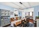 Well-lit dining room with hardwood floors, and an adjacent living area at 564 Gainesway N Dr, Greenwood, IN 46142