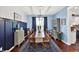 Charming dining room features a wooden table, upholstered chairs, and elegant blue accents at 564 Gainesway N Dr, Greenwood, IN 46142
