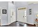 Welcoming foyer with hardwood floors, a modern front door, and decorative accents at 564 Gainesway N Dr, Greenwood, IN 46142