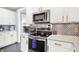 Modern kitchen with stainless steel appliances, ample counter space, and contemporary finishes at 564 Gainesway N Dr, Greenwood, IN 46142
