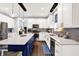Bright kitchen featuring a center island, stainless appliances, and white cabinets at 564 Gainesway N Dr, Greenwood, IN 46142