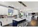 Open-concept kitchen with a center island, stainless appliances, and seamless flow to the dining area at 564 Gainesway N Dr, Greenwood, IN 46142