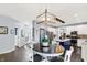 Open floor plan showcasing the kitchen island and dining area with stylish furnishings and decor at 564 Gainesway N Dr, Greenwood, IN 46142