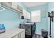 Functional laundry room features a washer, dryer, storage cabinets, and ample counter space at 564 Gainesway N Dr, Greenwood, IN 46142